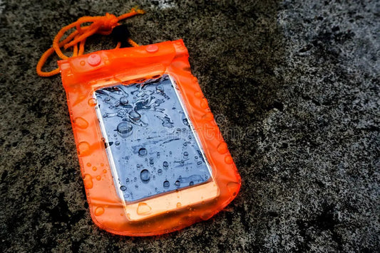 Orange waterproof phone pouch with water droplets on grunge background